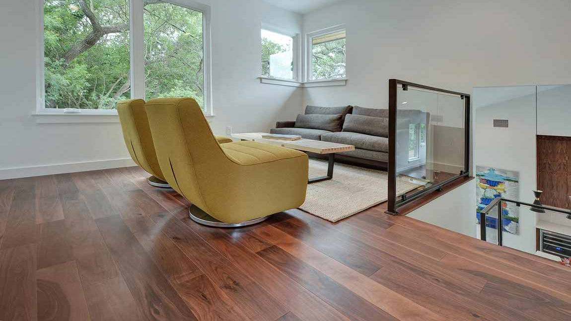 Hardwood flooring in a sitting area, installation services available.